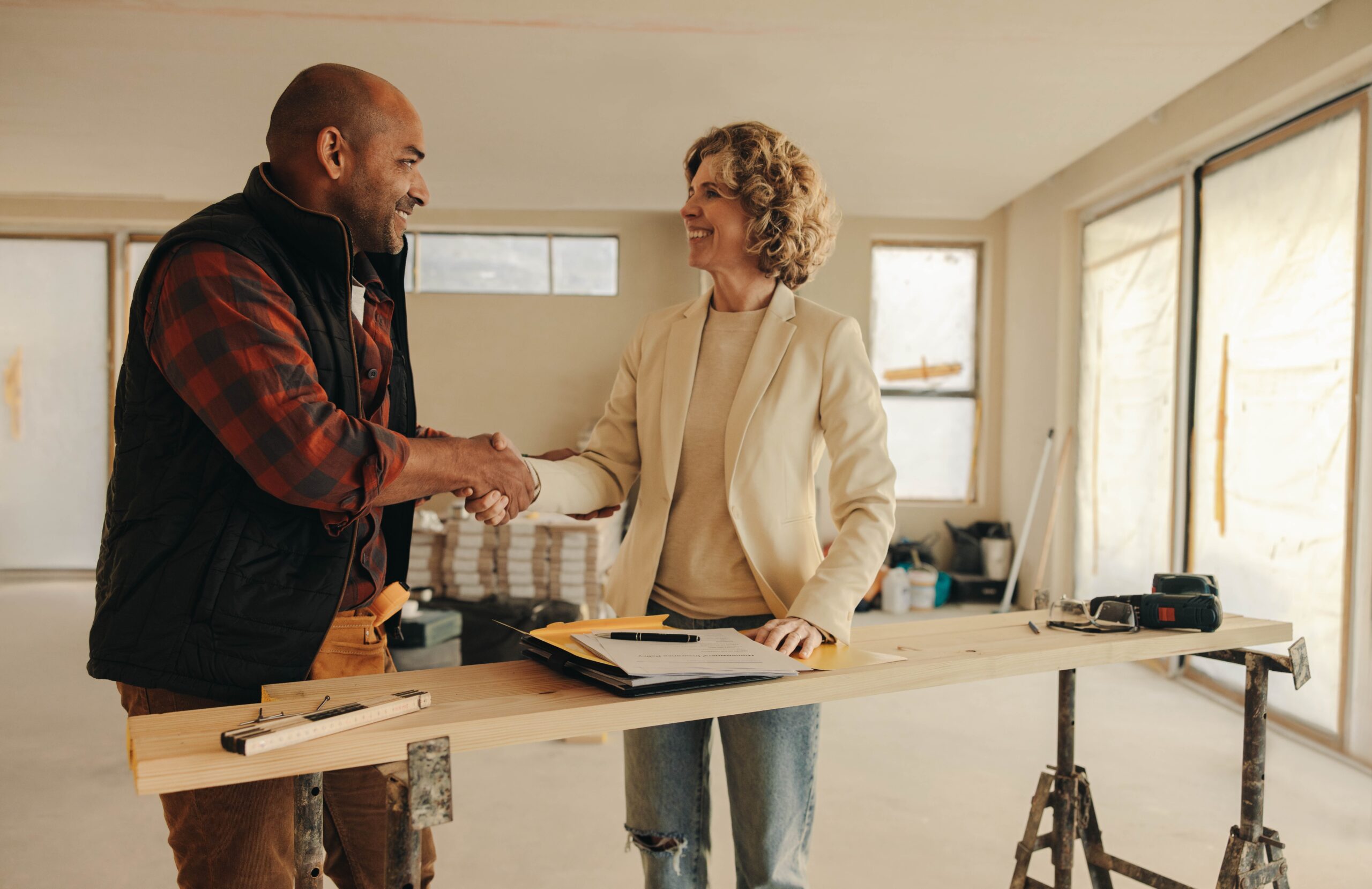 A handshake between a business owner and contractor, symbolizing qualified lead generation, trust, and conversion-driven demand marketing.